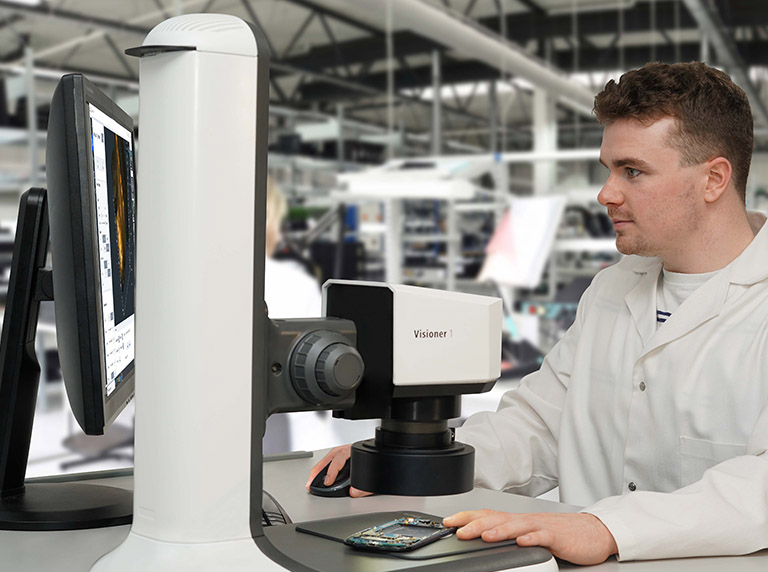 DeepFocus1_bench_stand_ring_light_mobile_phone_inspection_768x572px Deep Focus 1 EDOF digital microscope on bench stand inspecting mobile phone SMT